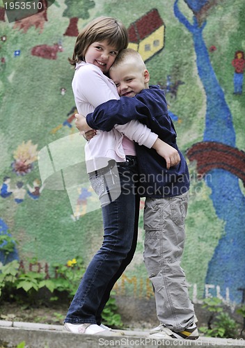 Image of happy brother and sister outdoor in park