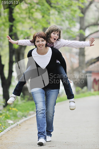 Image of happy girl and mom outdoor