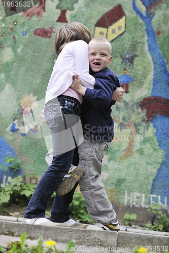 Image of happy brother and sister outdoor in park