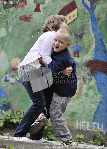 Image of happy brother and sister outdoor in park