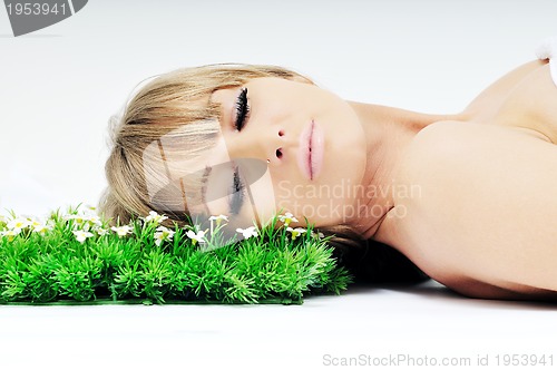 Image of woman face on grass 