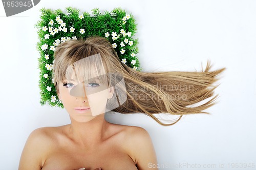 Image of woman face on grass 