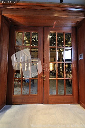 Image of big wooden door in restaurant