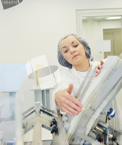 Image of woman worker in pharmacy company