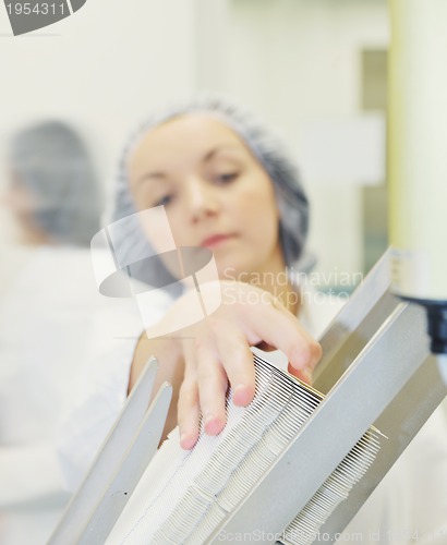 Image of woman worker in pharmacy company