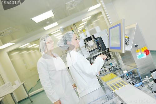 Image of woman worker in pharmacy company