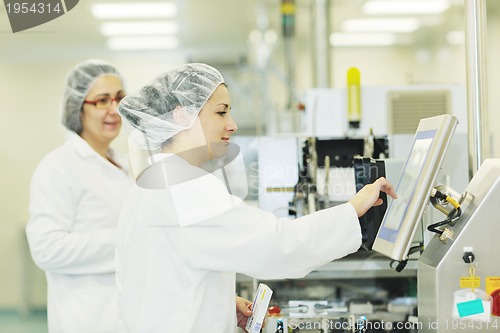 Image of woman worker in pharmacy company