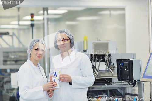 Image of woman worker in pharmacy company