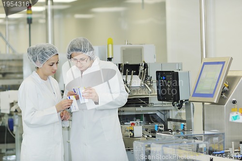 Image of woman worker in pharmacy company