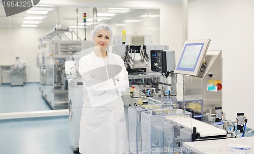 Image of woman worker in pharmacy company