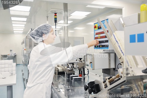 Image of woman worker in pharmacy company