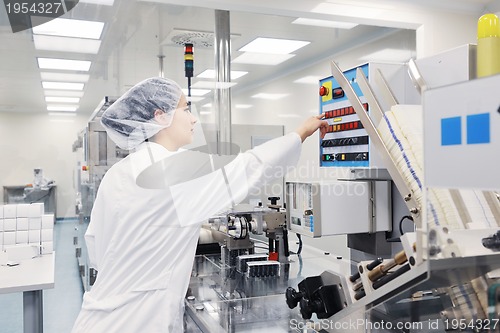 Image of woman worker in pharmacy company