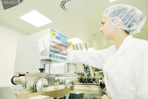 Image of woman worker in pharmacy company