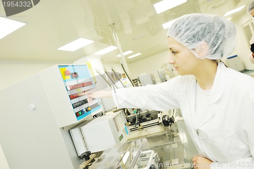 Image of woman worker in pharmacy company