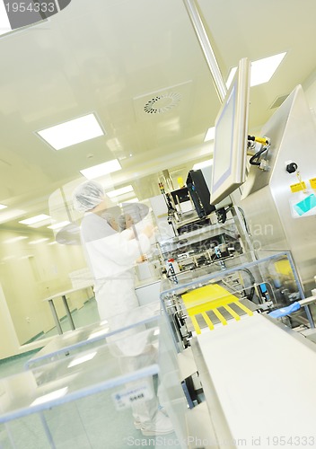 Image of woman worker in pharmacy company