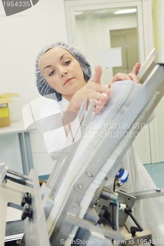 Image of woman worker in pharmacy company