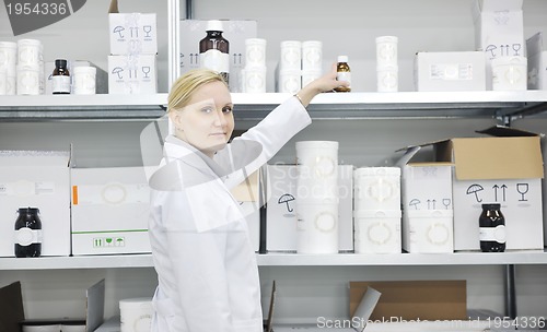Image of woman worker in pharmacy company