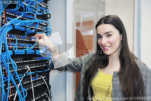 Image of woman it engineer in network server room