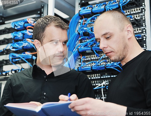 Image of it engineer in network server room