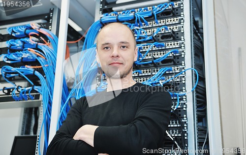 Image of young it engeneer in datacenter server room