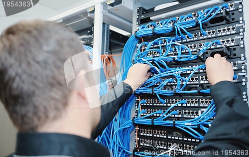 Image of young it engeneer in datacenter server room