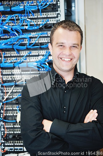 Image of young it engeneer in datacenter server room