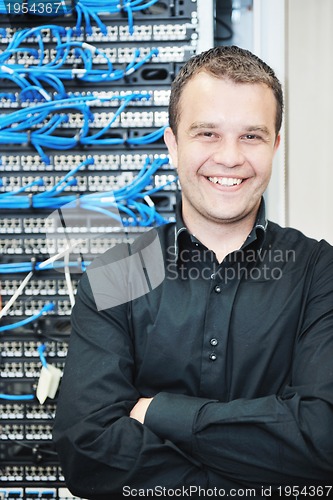 Image of young it engeneer in datacenter server room