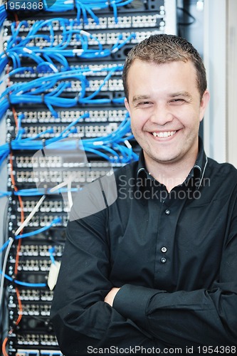 Image of young it engeneer in datacenter server room