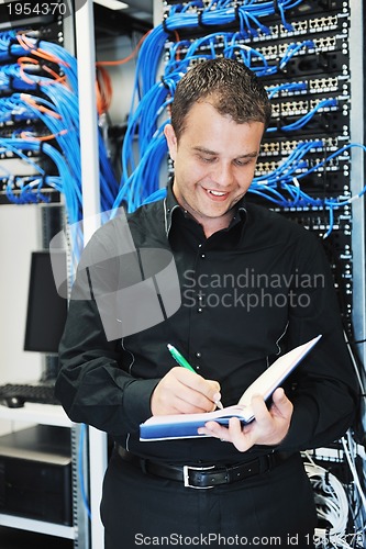 Image of young it engeneer in datacenter server room