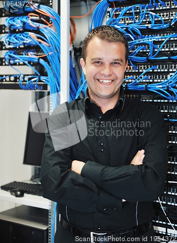 Image of young it engeneer in datacenter server room