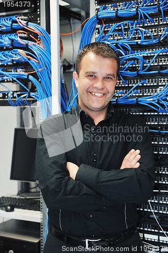 Image of young it engeneer in datacenter server room