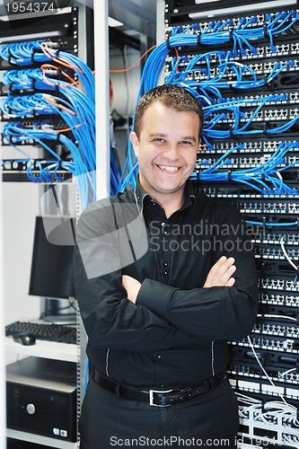 Image of young it engeneer in datacenter server room