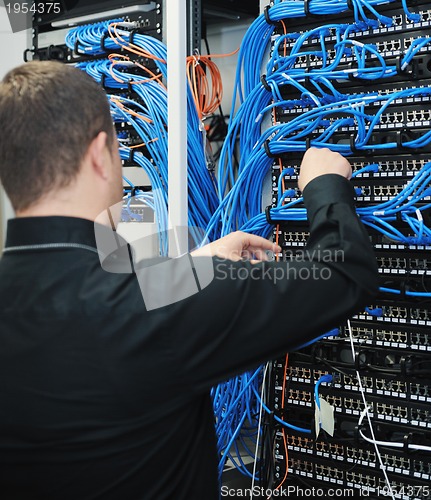 Image of young it engeneer in datacenter server room