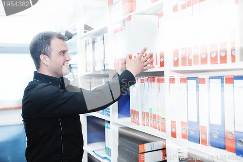 Image of male adult in archive library