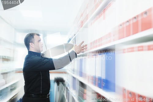 Image of male adult in archive library