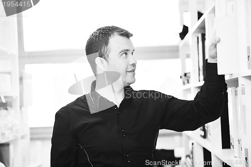 Image of male adult in archive library