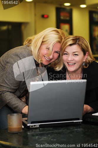 Image of happy mature woman work on laptop