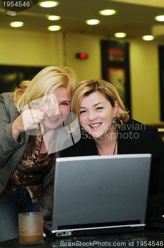 Image of happy mature woman work on laptop