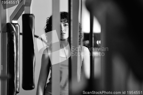 Image of young woman practicing fitness and working out