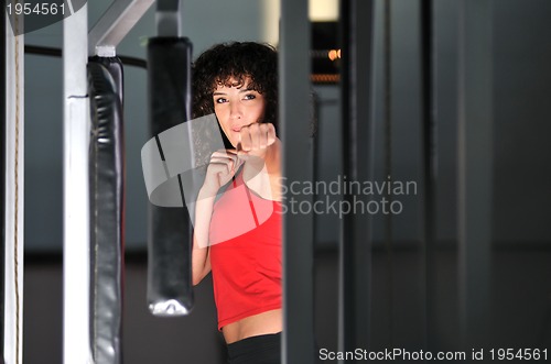 Image of young woman practicing fitness and working out