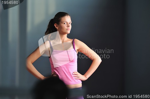 Image of young woman practicing fitness and working out