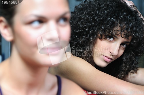 Image of young woman practicing fitness and working out