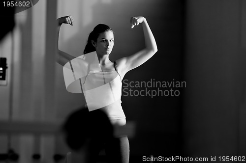 Image of young woman with strong arms