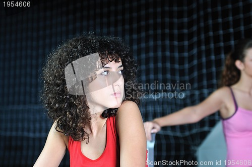 Image of young woman rerlaxing fitness and working out