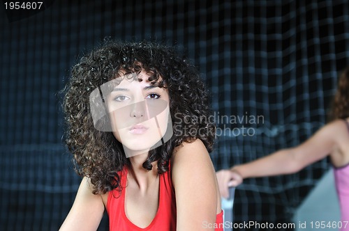 Image of young woman rerlaxing fitness and working out