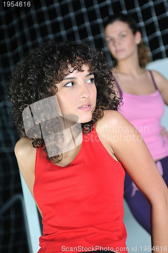 Image of two women work out   in fitness club