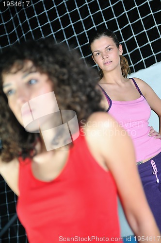 Image of two women work out   in fitness club