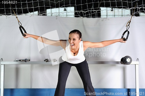 Image of young woman practicing fitness and working out