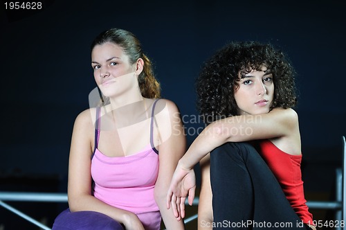 Image of two women work out  in fitness club