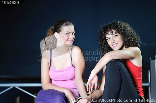 Image of two women work out  in fitness club